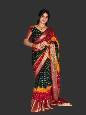 Woman wearing a traditional saree in a living room setting
